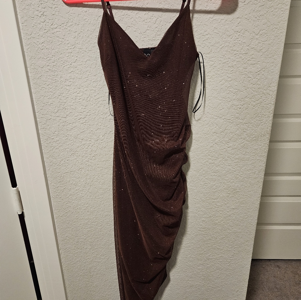 A medium length burgundy sparkly dress